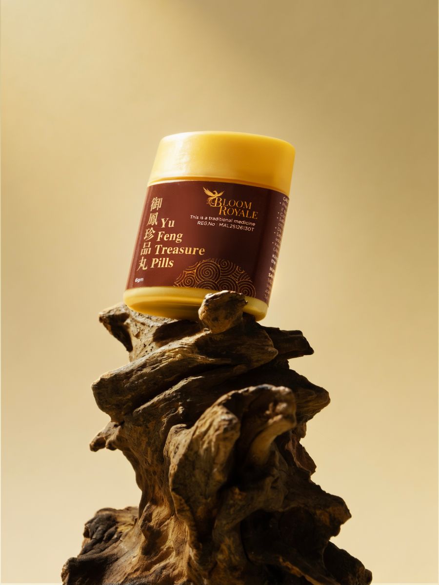 A single Bloom Royale bottle on driftwood
